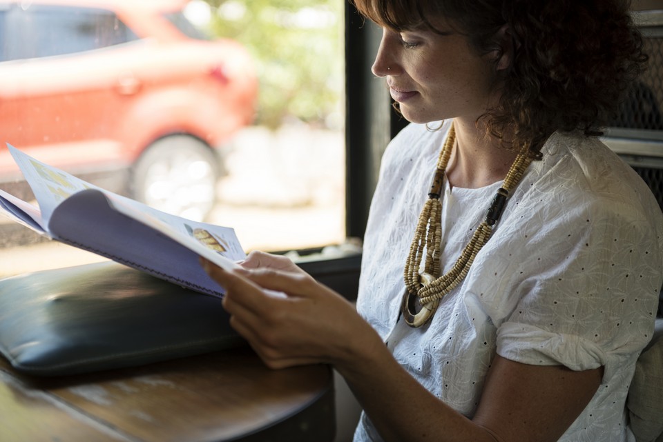 Woman reading magazine