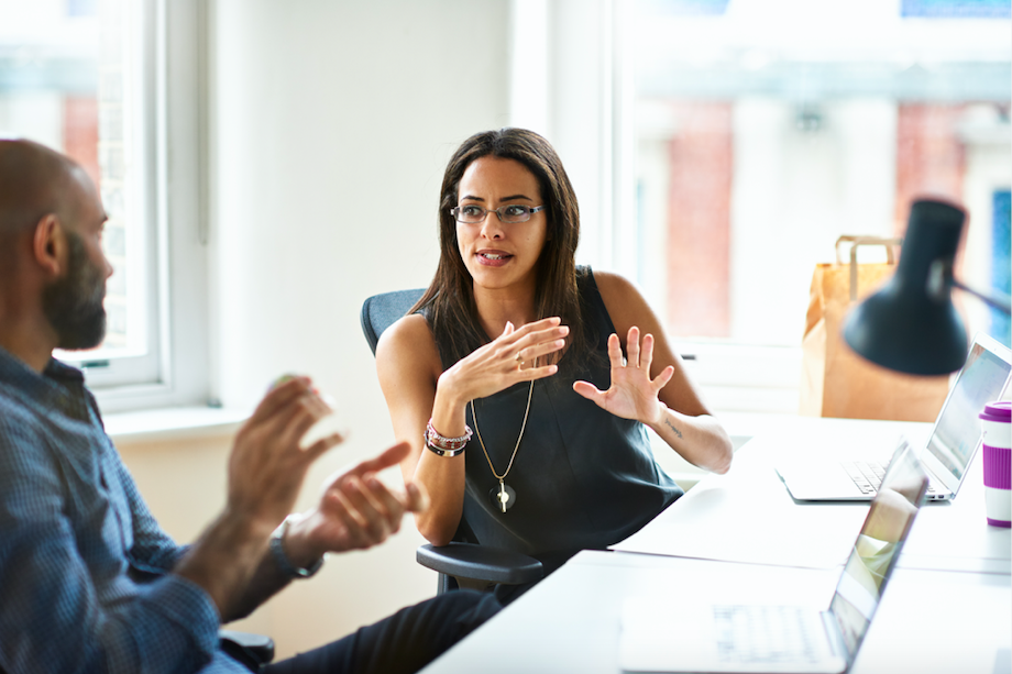 image of two people in office having conversation