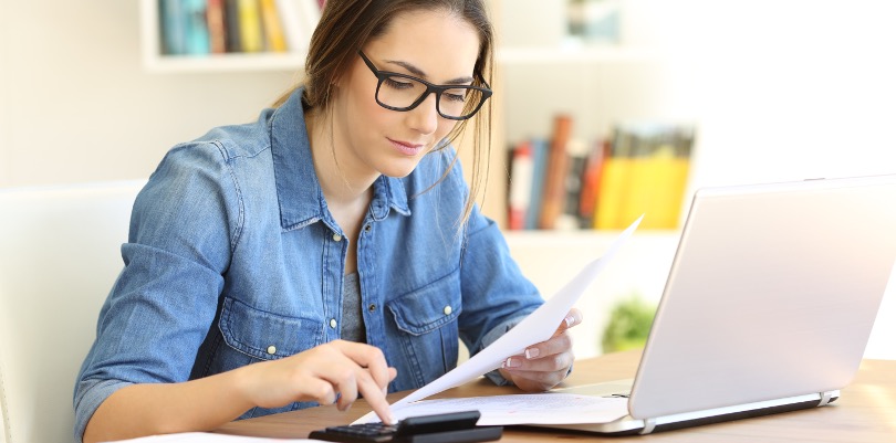 Business woman calculating costs for improved purchasing via a framework agreement